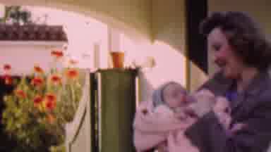 San Diego California USA (1955): Mom With Her Baby In Pink Blanke Wearing Blue Hat