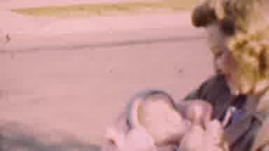 San Diego California USA (1955): Woman Walking Smiling And Carrying Baby