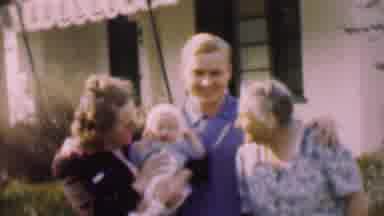San Diego California USA (1955): Family Kissing A Baby