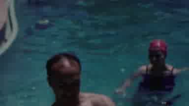 Seaside New Jersey USA (1949): Three People Swimming In A Pool And Playing
