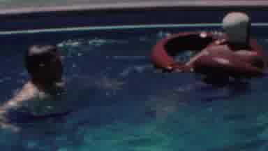 Seaside New Jersey USA (1949): Two People Splash And Float In A Cement Pool On A