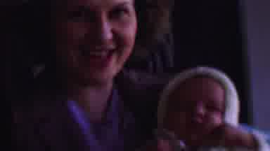 San Diego California USA (1955): Mother Sings And Rocks Sleeping Baby