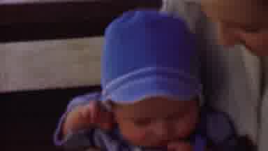 San Diego California USA (1955): Head Bobbing Baby In Mommy's Arms Needs Nap After