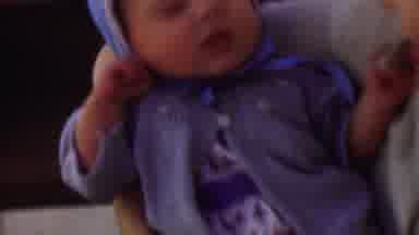San Diego California USA (1955): Sleepy Child Nods Off In Mother's Arms
