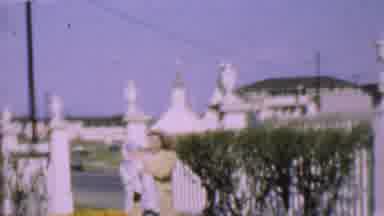 SAN DIEGO CALIFORNIA USA-1955: Woman Holding Baby Outside Church