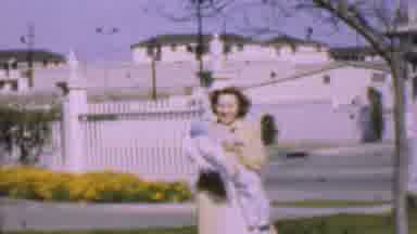 San Diego California USA (1955): A Woman Holding A Baby And Waving