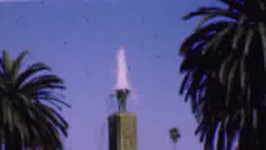 San Diego California USA (1955): Mother Carrying Child In Park In Front Of