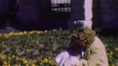 San Diego California USA (1955): Mother Taking Care Of Her Son In The Garden