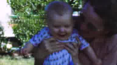 San Diego California USA (1955): Mom Kisses And Plays With Her Baby