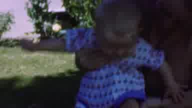 San Diego California USA (1955): Happy Baby Laughs In Yard
