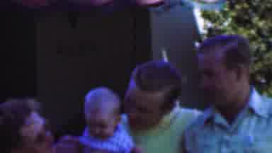 San Diego California USA (1955): Family Enjoys Moment With Baby