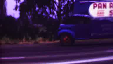 Phoenix Arizona USA (1956): A Large Blue Moving Truck Is Pulling Onto The Side Of