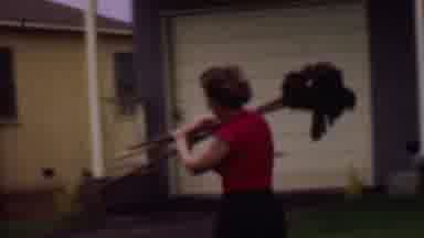Phoenix Arizona USA (1956): Woman Swiftly Walking To Storage To Return Mops