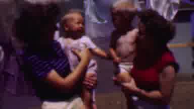 PHOENIX ARIZONA USA-1956: Two Babies Befriending Each Other Outside