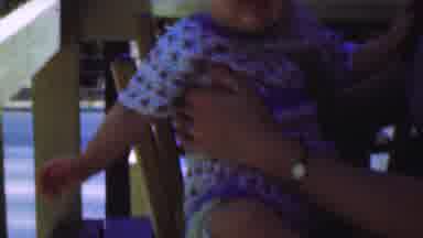 San Diego California USA-1955: Baby Taking First Steps on Porch