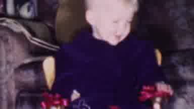 Phoenix Arizona USA (1956): Baby At Christmas Sitting In Pile Of Presents Smiling