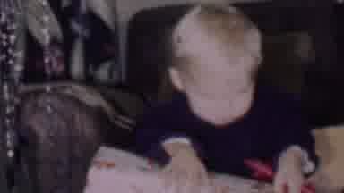 Phoenix Arizona USA (1956): A Little Boy Struggling To Open Presents