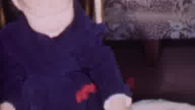 Phoenix Arizona USA-1956: A Child's Curiosity Opening a Present