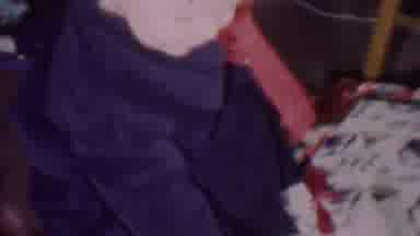 Phoenix Arizona USA (1956): Toddler Rips Open Wrapping Paper And Looks At
