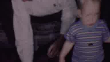 Phoenix Arizona USA (1956): Child Standing On Floor Surrounded By Two Adults