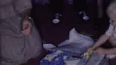 Phoenix Arizona USA (1956): Boy Opening Gift