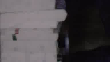 Phoenix Arizona USA (1956): A Smiling Child Peeking Out From Behind A White Wooden