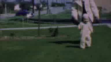 DALLAS TEXAS USA-1956: Small Toddler Walking and Crawling on Grass