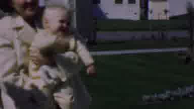 Dallas Texas USA (1956): Baby Celebrating With Joyous Dancers