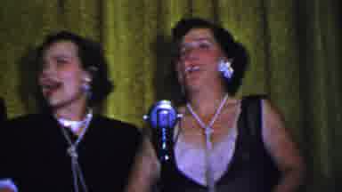 Dallas Texas USA-1956: Women Singing on Stage with Microphone