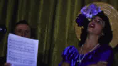 Dallas Texas USA (1956): Woman Singing In A Blue Dress And Straw Hat