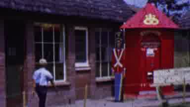 Solvang California USA (1955): Boy Walking Down Street Past Shops