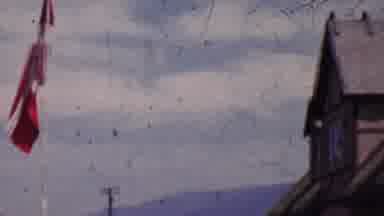 Solvang California USA (1955): American Flag Fluttering At Front House
