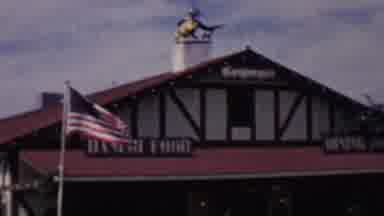 Solvang California USA (1955): American Flag Waving In Front Of A Danish
