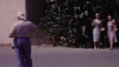 Solvang California USA (1955): Boy Walking Toward Waving Women