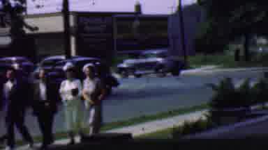 Detroit Michigan USA (1950): People Walking And Waving On A Busy Street