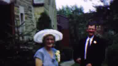 Detroit Michigan USA (1950): People In Formal Wear Waiting While A Girl Walks By