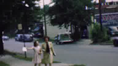 Detroit Michigan USA (1950): Two Ladies Stroll Down A Busy Street