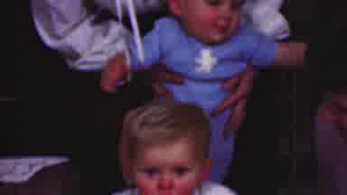 Terra Haute Indiana USA (1963): Toddler In Blue Is Placed On Child's Neck For