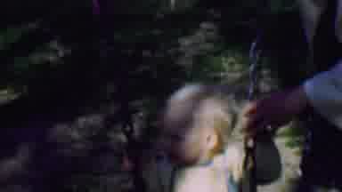 TERRA HAUTE INDIANA USA-1963: Young Boy In Yellow Romper Being Pushed On Swing