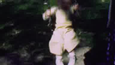 Terra Haute Indiana USA (1963): Child Swinging And Then Walking On A Lawn