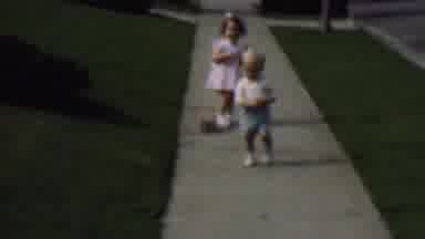 Terra Haute Indiana USA (1963): Two Young Children Playing On A Sidewalk.