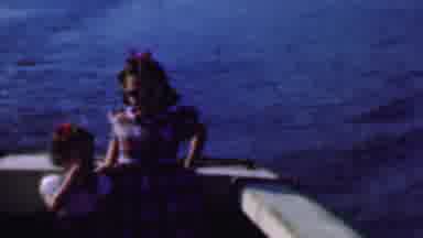 San Diego California USA (1961): Two Young Girls Waving From The Back Of The Boat