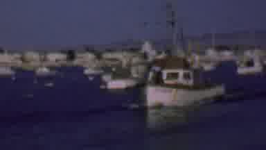 San Diego California USA (1961): A Fishing Boat Motors Through A Harbor Filled