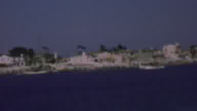 San Diego California USA (1961): A Boat Going Down River Near A Town