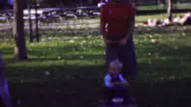 San Diego California USA (1961): A Blond Boy Waves To The Camera In Stroller