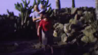 San Diego California USA (1961): Family Makes Way Through Tough Terrain