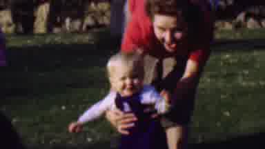 San Diego California USA (1961): Cute Toddler Playing With Parents In Open Field