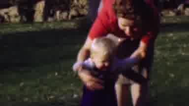 San Diego California USA (1961): Women Trying To Help Her Child Walk