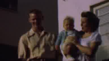 San Diego California USA (1961): A Young Mother And Father Pose For A Picture With