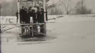 Albany New York USA (1937): Diver Makes Icy Plunge As Warm People Look On